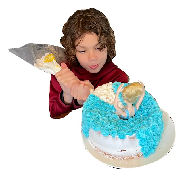 Riley decorating cake